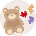 Roztomilý hnedý medvedík s farebnými puzzle kúskami vedľa seba